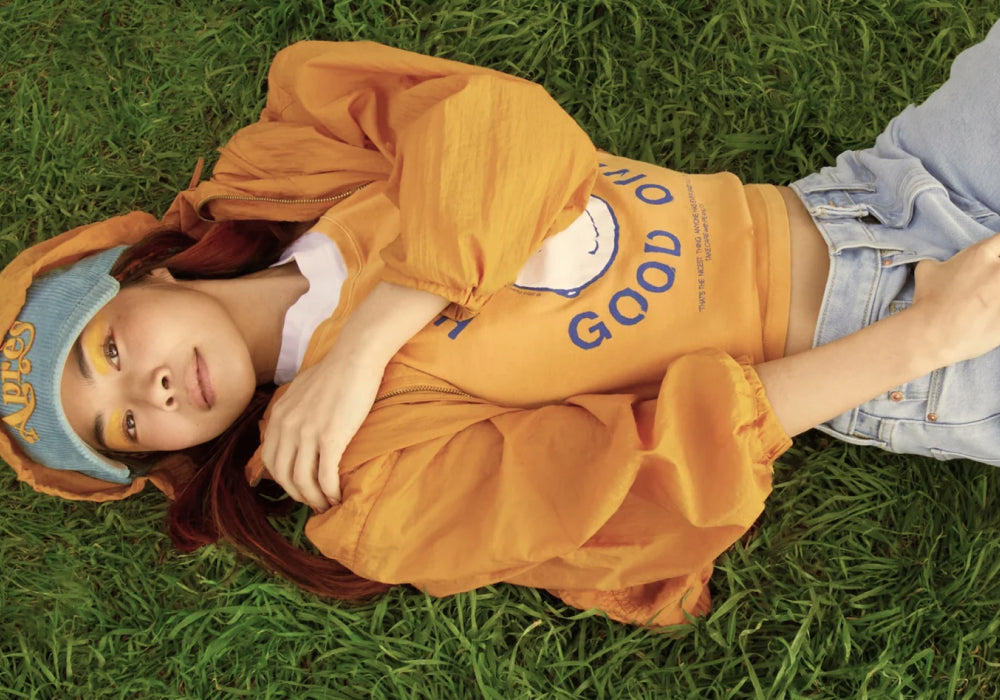 Woman laying comfortably on lush green grass